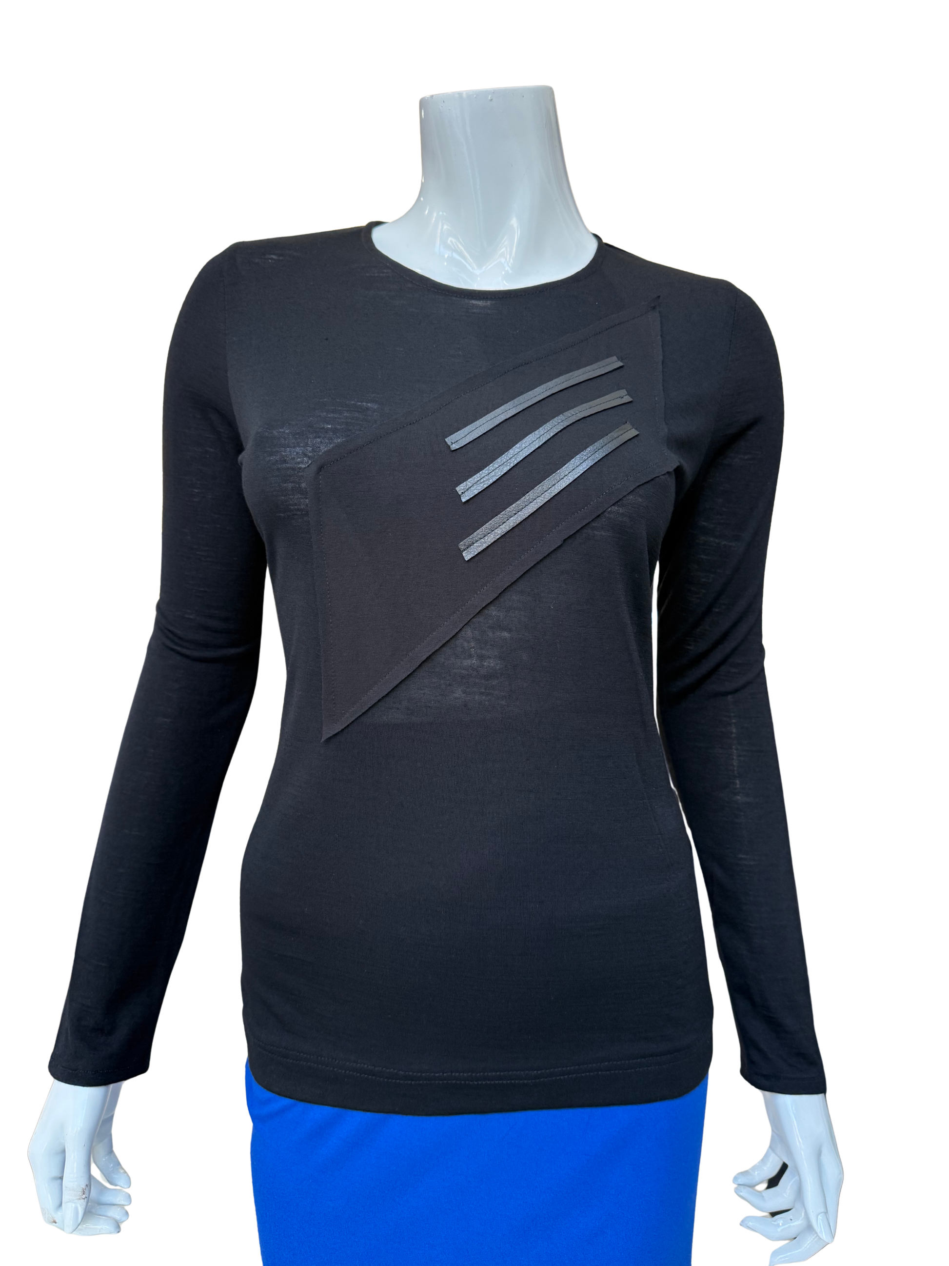 Front view of modern cotton lycra top in black featuring bold diagonal washable leather trim panel with long sleeves and contemporary geometric design