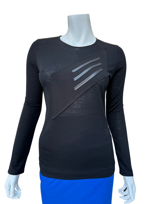Front view of modern cotton lycra top in black featuring bold diagonal washable leather trim panel with long sleeves and contemporary geometric design