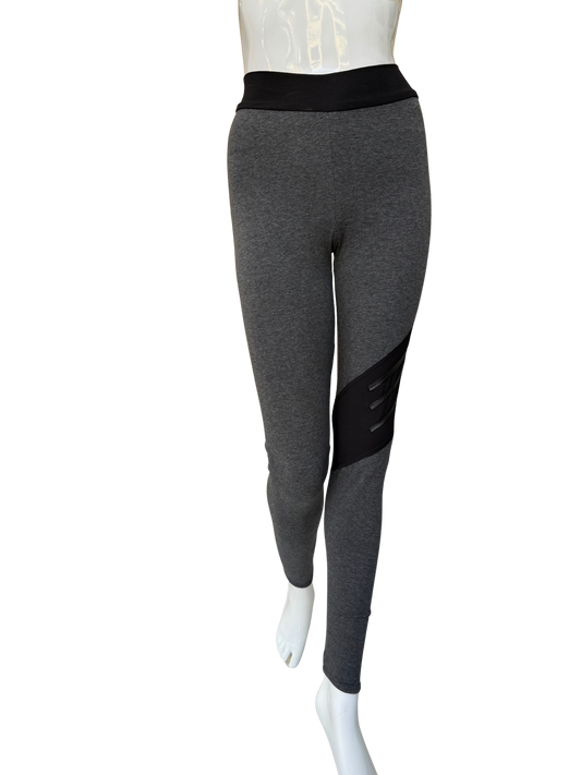 Front view of bold cotton lycra leggings in charcoal featuring diagonal washable leather trim panel and contrasting black waistband with full-length fit