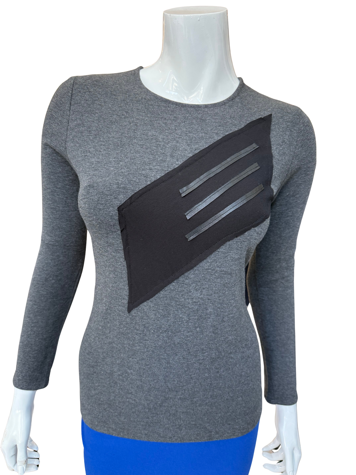 Front view of distinctive cotton lycra top in charcoal featuring bold diagonal washable leather trim panel with long sleeves and contemporary geometric design