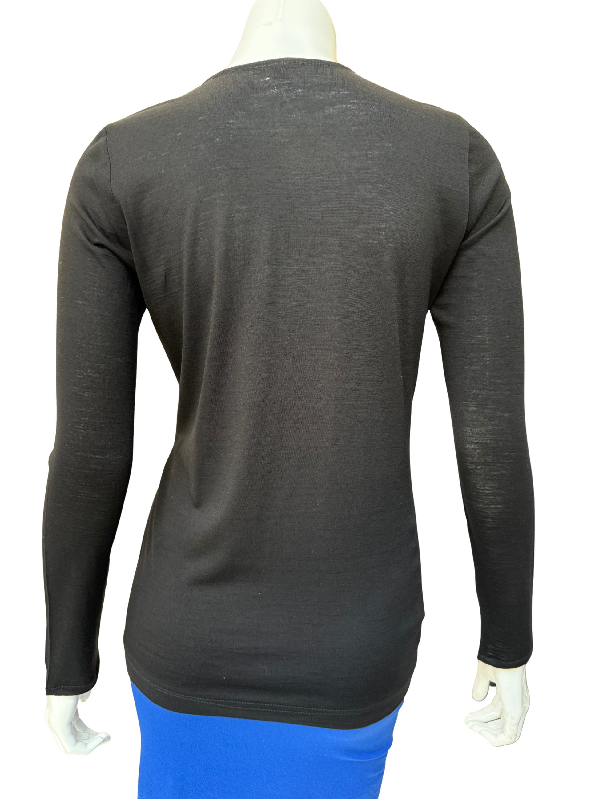 Back view of black cotton lycra top showing clean construction and comfortable stretch fit with quality fabric and sophisticated silhouette