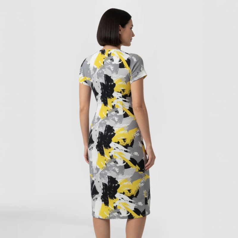 ack view of short-sleeve cotton viscose dress showing zip back closure and continuous abstract brushstroke print wrapping fully around the garment. Made by SWABY - A New York Fashion Designer.