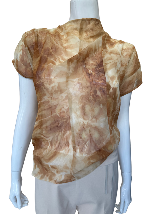 Front view of striking watercolor print blouse in camel tones featuring abstract artistic pattern with flowing chiffon overlay and cap sleeves creating sophisticated visual depth