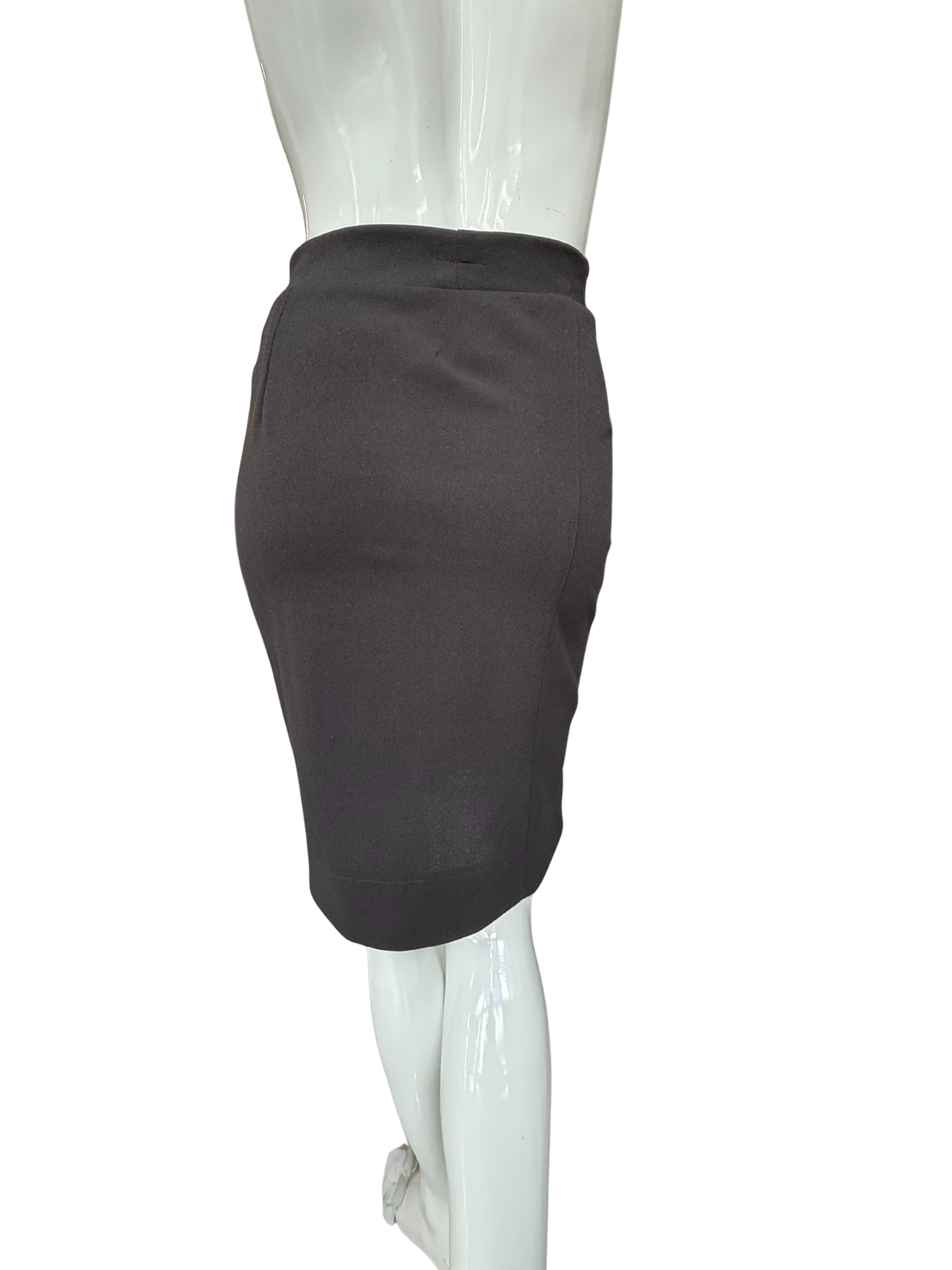 Back view of black pencil skirt displaying sleek tailoring and high waistband with quality stretch fabric construction and sophisticated fit
