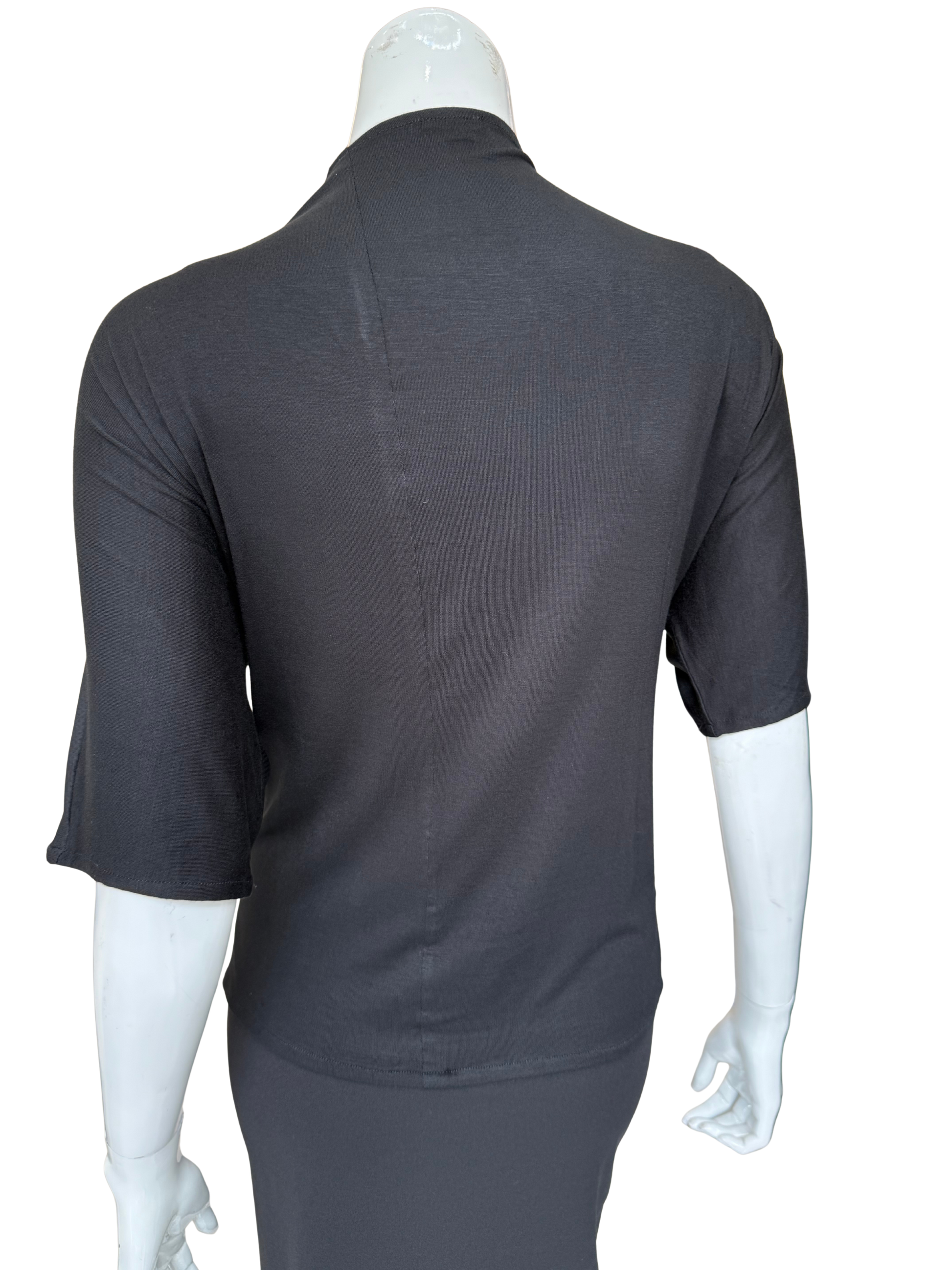 Back view of bold exploding dot top in charcoal showing clean knit construction and 3/4 sleeves with sophisticated silhouette and quality fabric details