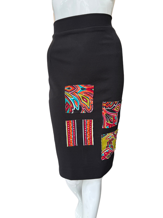 Side view of sleek black pencil skirt showing classic silhouette and knee-length cut with quality construction and comfortable high waistband
