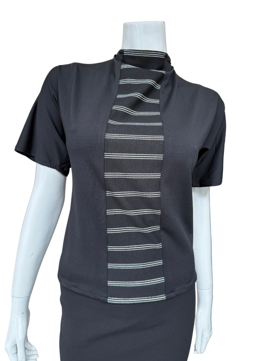 Front view of black striped center top featuring asymmetrical neckline with tie detail and distinctive vertical panel creating modern visual interest and sophisticated appeal