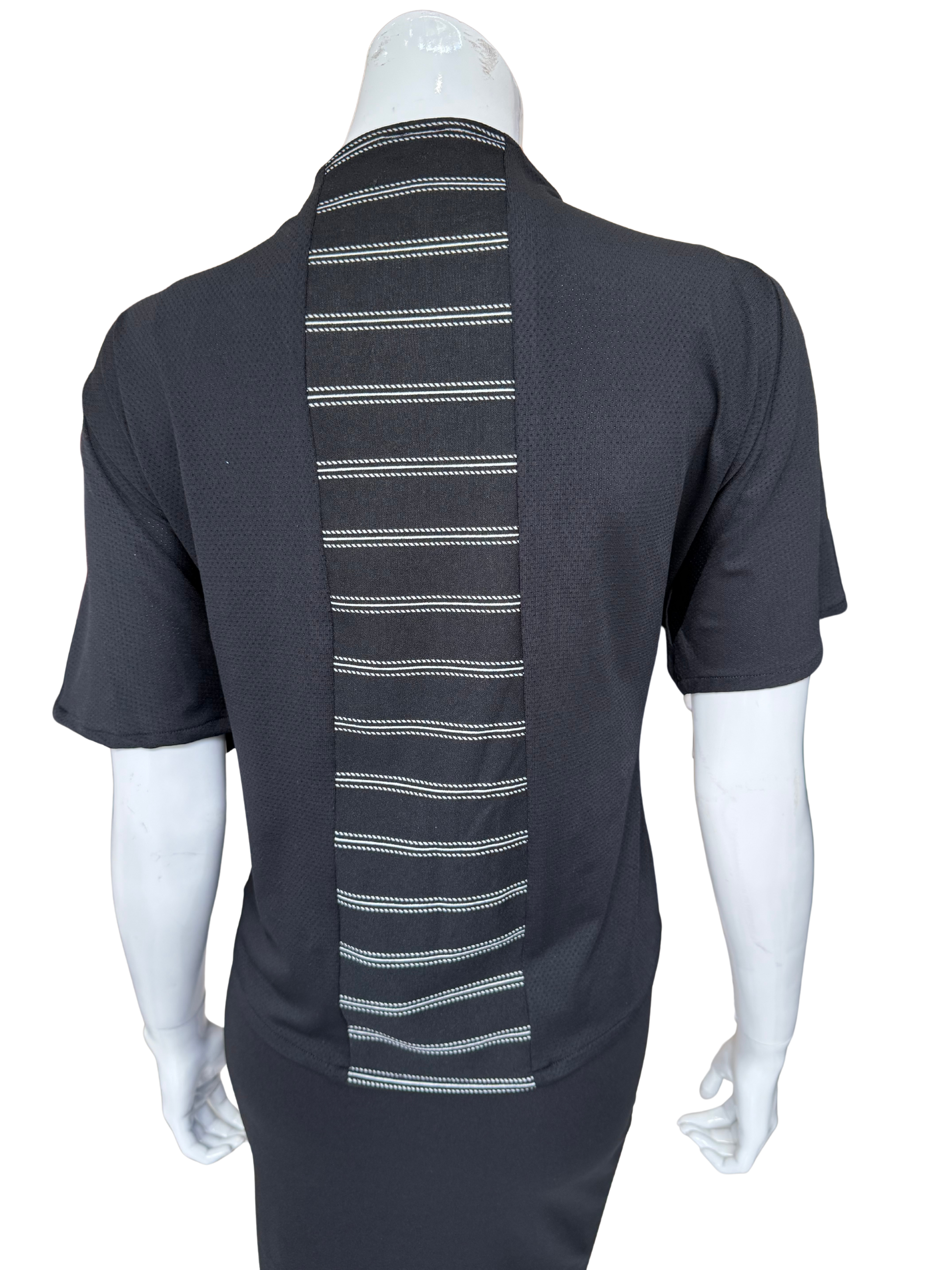 Back view of striking striped center knit top in charcoal showing vertical white striped panel detail and quality knit construction with short sleeves