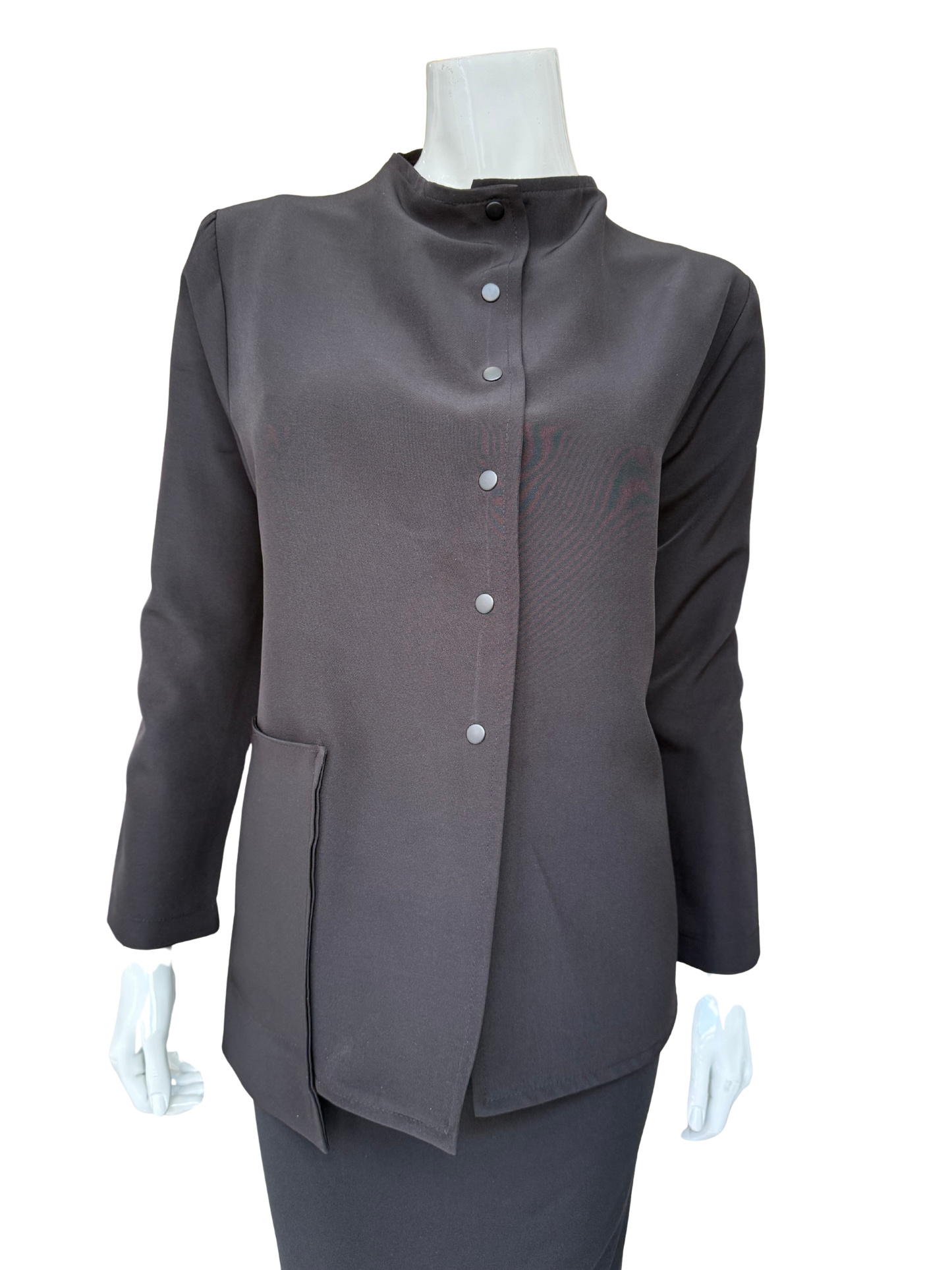 Front view of essential woven jacket featuring distinctive snap front closure and modern stand collar in versatile charcoal tone