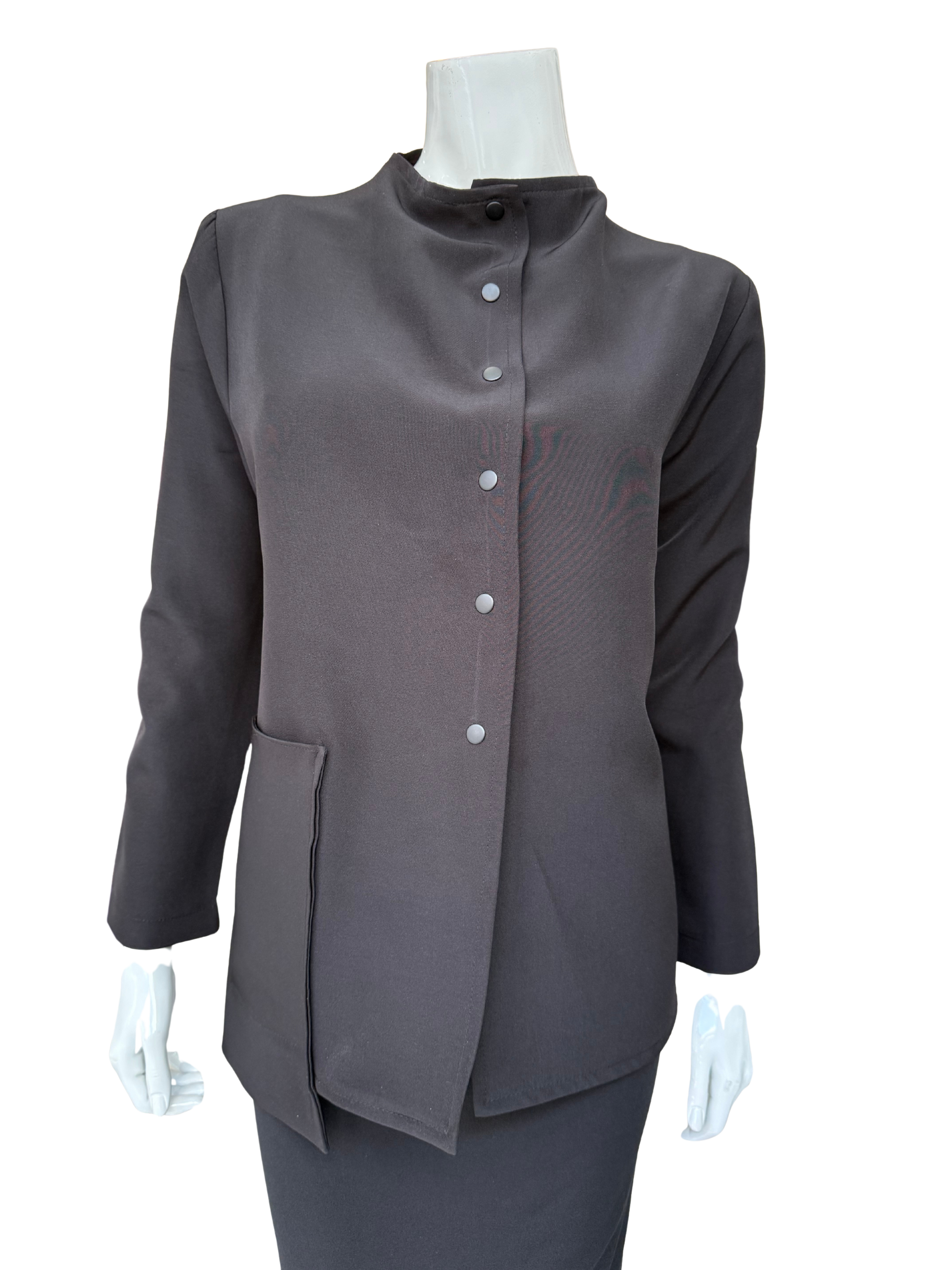 Front view of essential woven jacket featuring distinctive snap front closure and modern stand collar in versatile charcoal tone