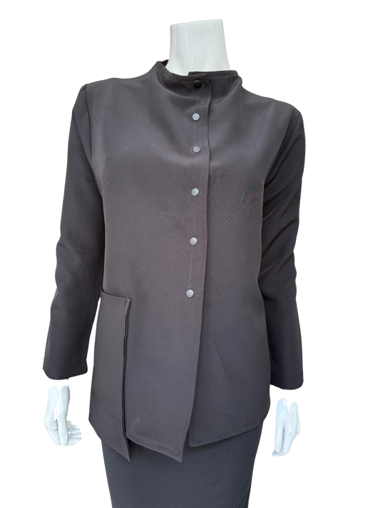 Front view of essential woven jacket featuring distinctive snap front closure and modern stand collar in versatile charcoal tone