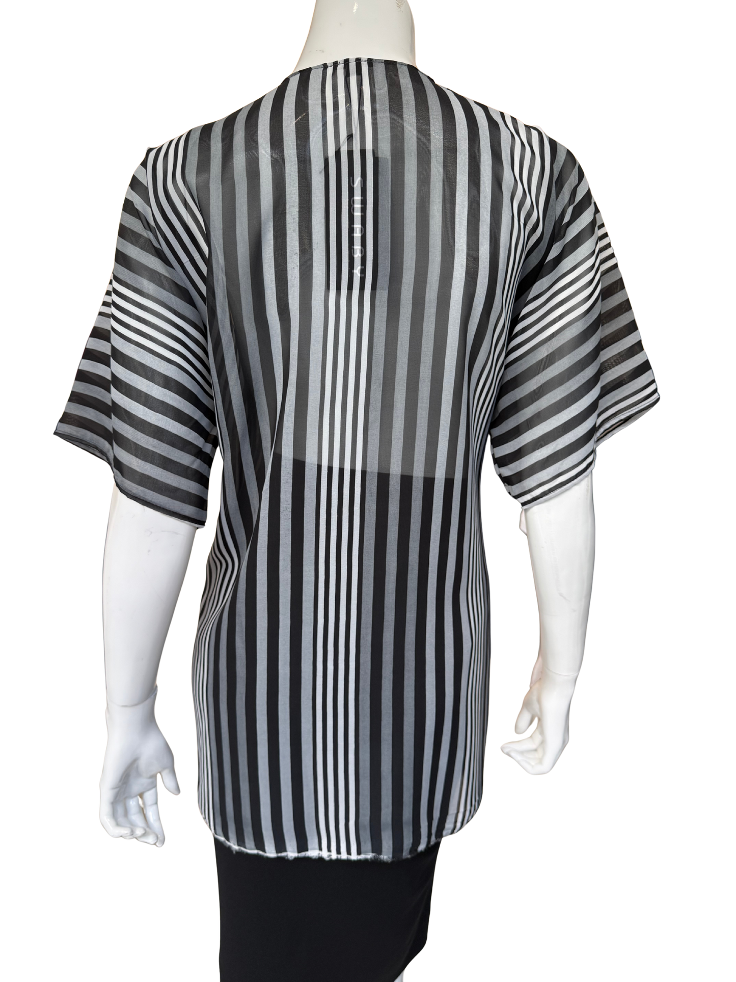 Back view of modern striped chiffon blouse showing dynamic vertical stripes in black and grey with flowing construction and short sleeves