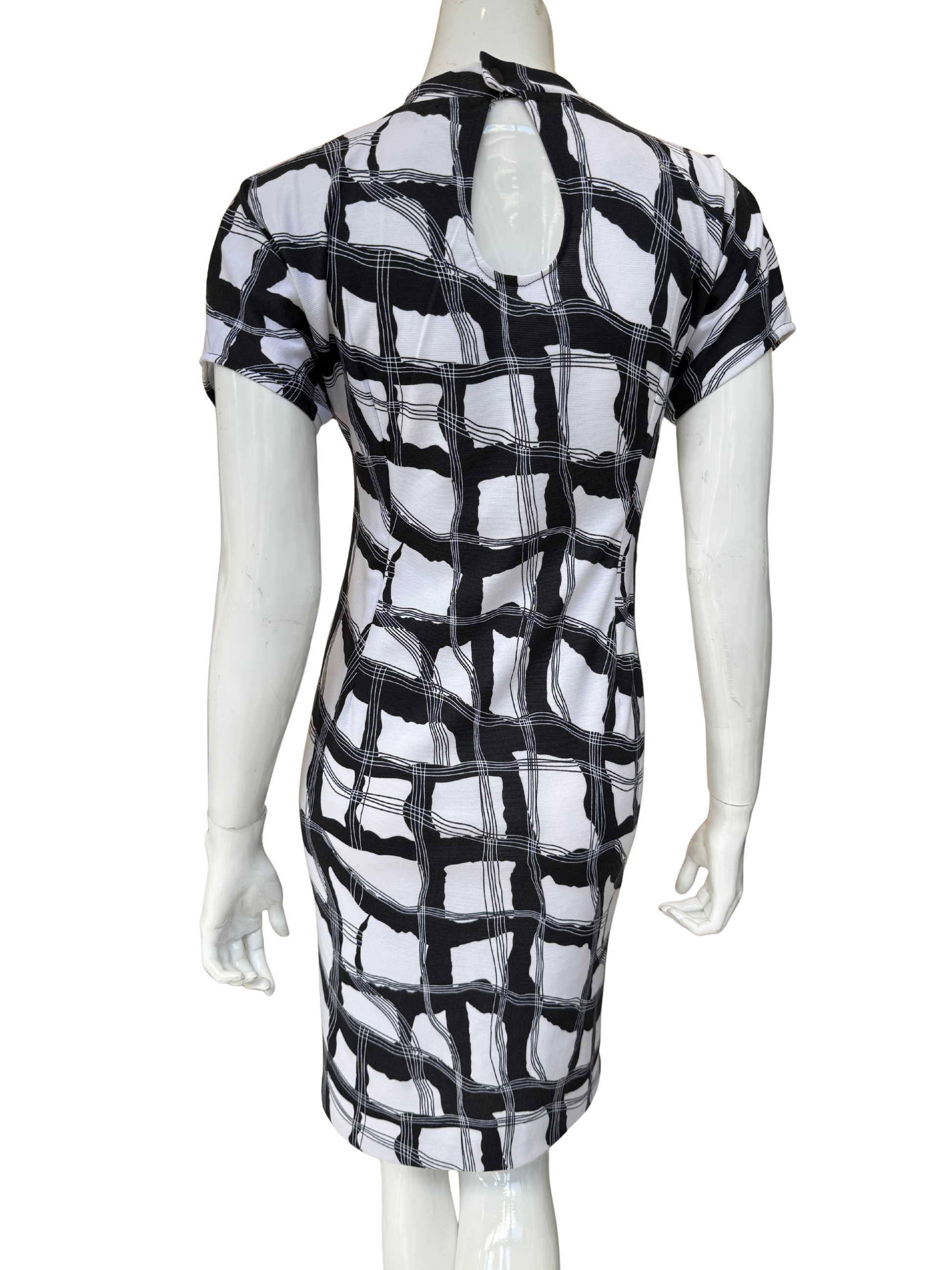 Back view of geometric print dress showing keyhole back detail and continuous pattern design in quality stretch crepe construction with modern appeal