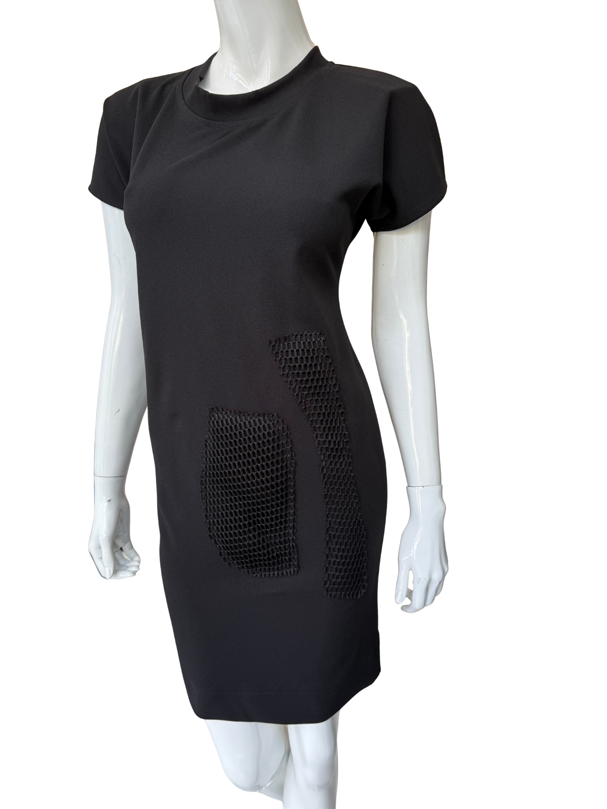 Front view of contemporary black stretch crepe dress featuring bold mesh panel details and modern minimalist design with striking visual texture