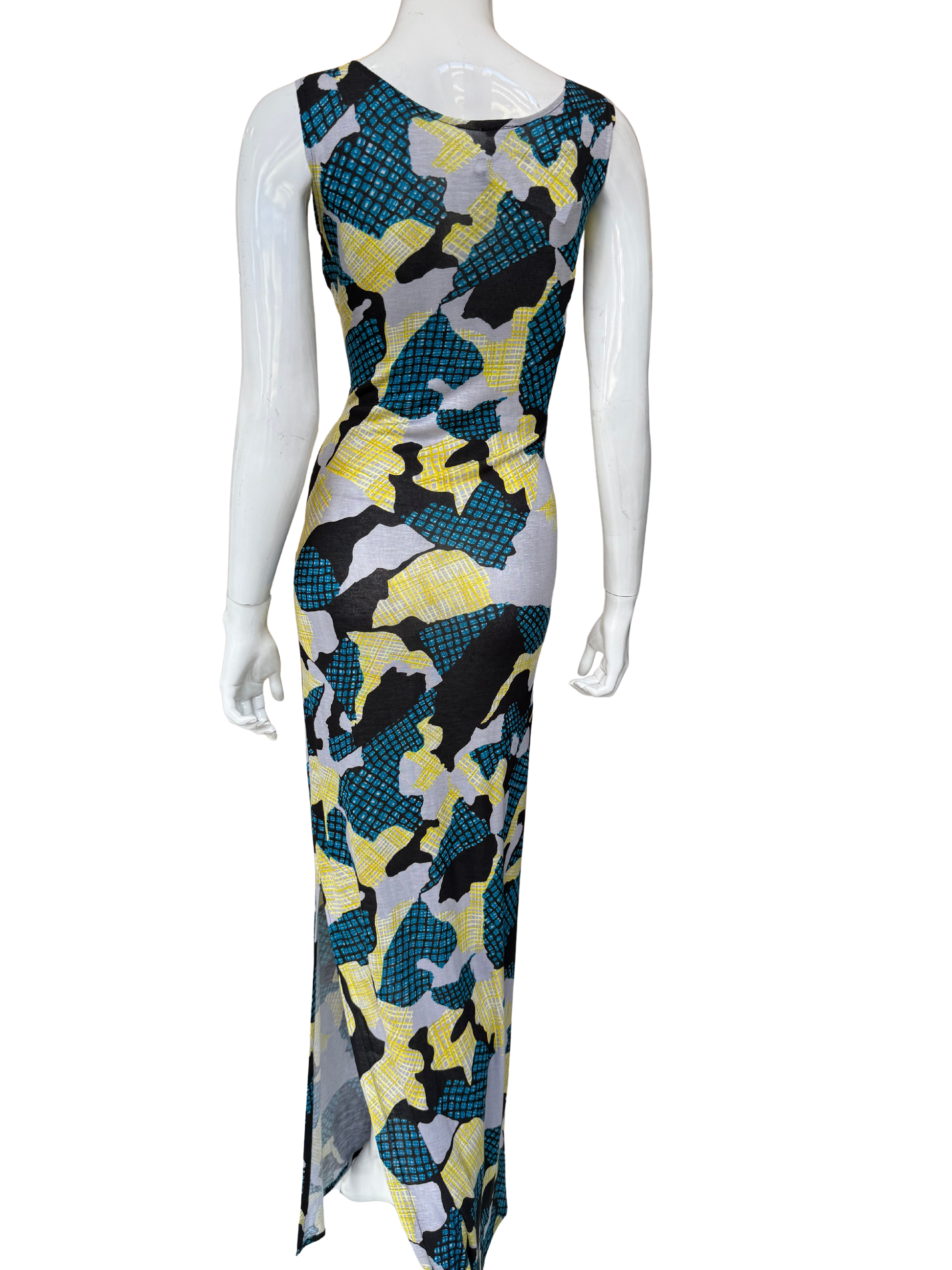 Back view of multi-color abstract print maxi dress showing continuous bold pattern and sleeveless design with elegant draping and sophisticated proportions