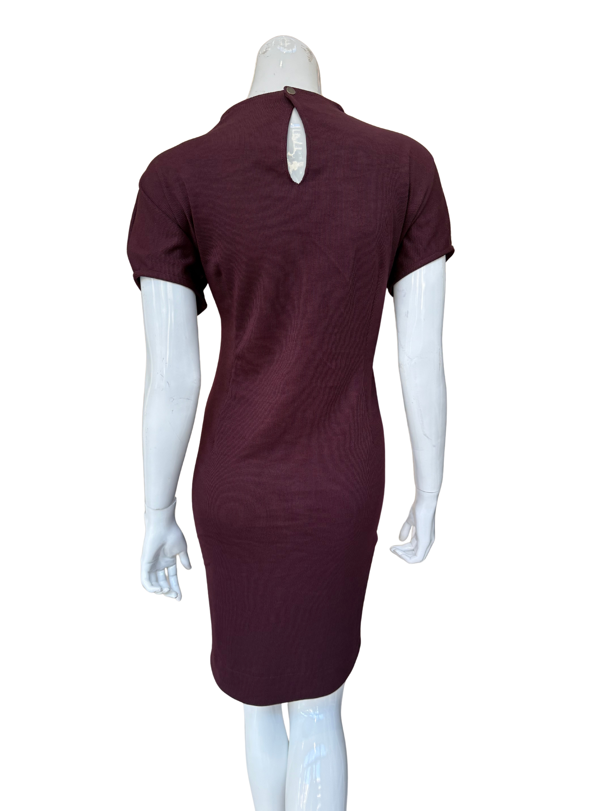 Back view of burgundy ribbed knit dress showing keyhole detail and quality textured fabric construction with sophisticated modern appeal