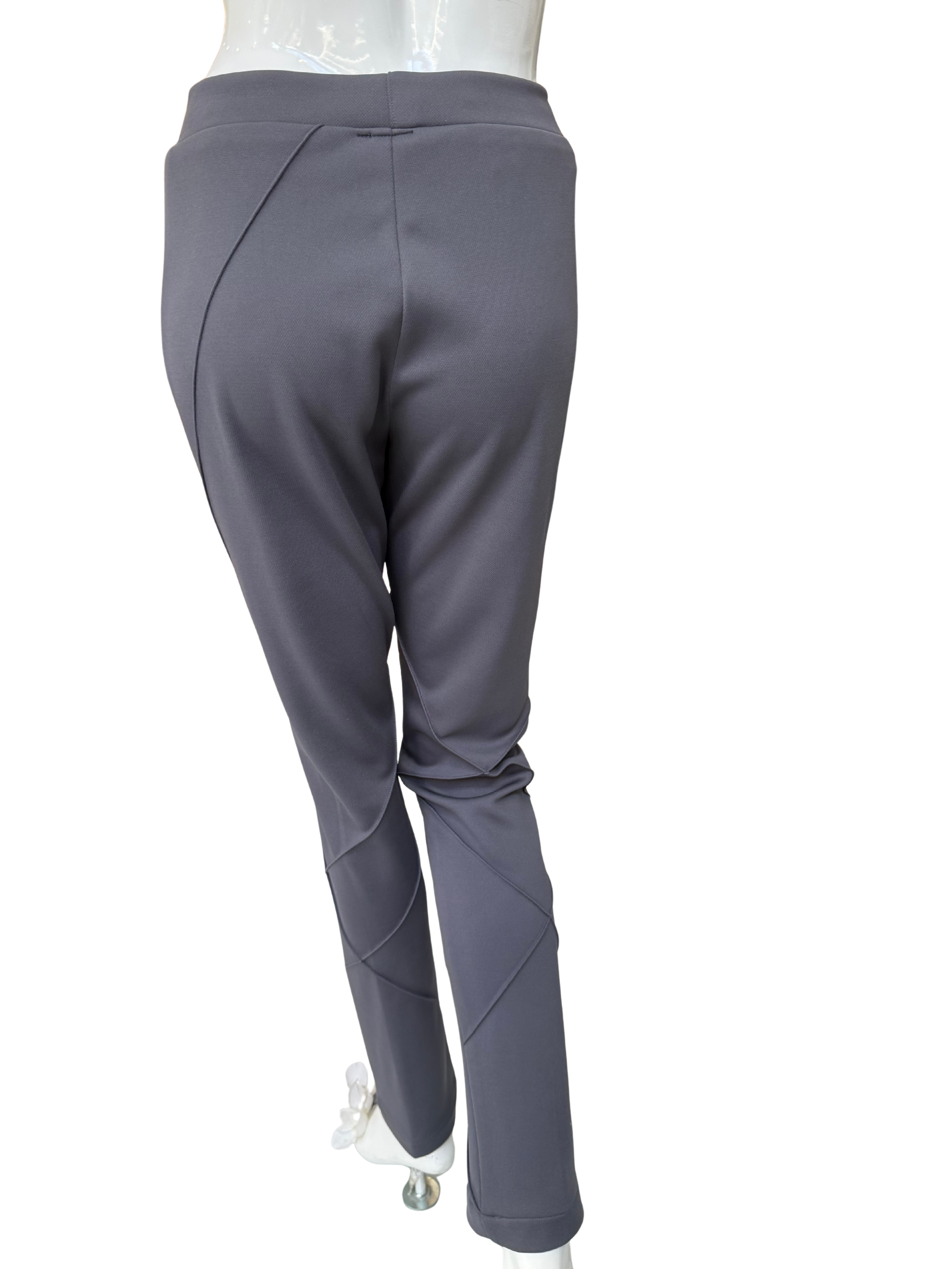 Detail view of charcoal stretch crepe pants featuring strategic seaming placement and comfortable waistband with quality construction and structured appearance