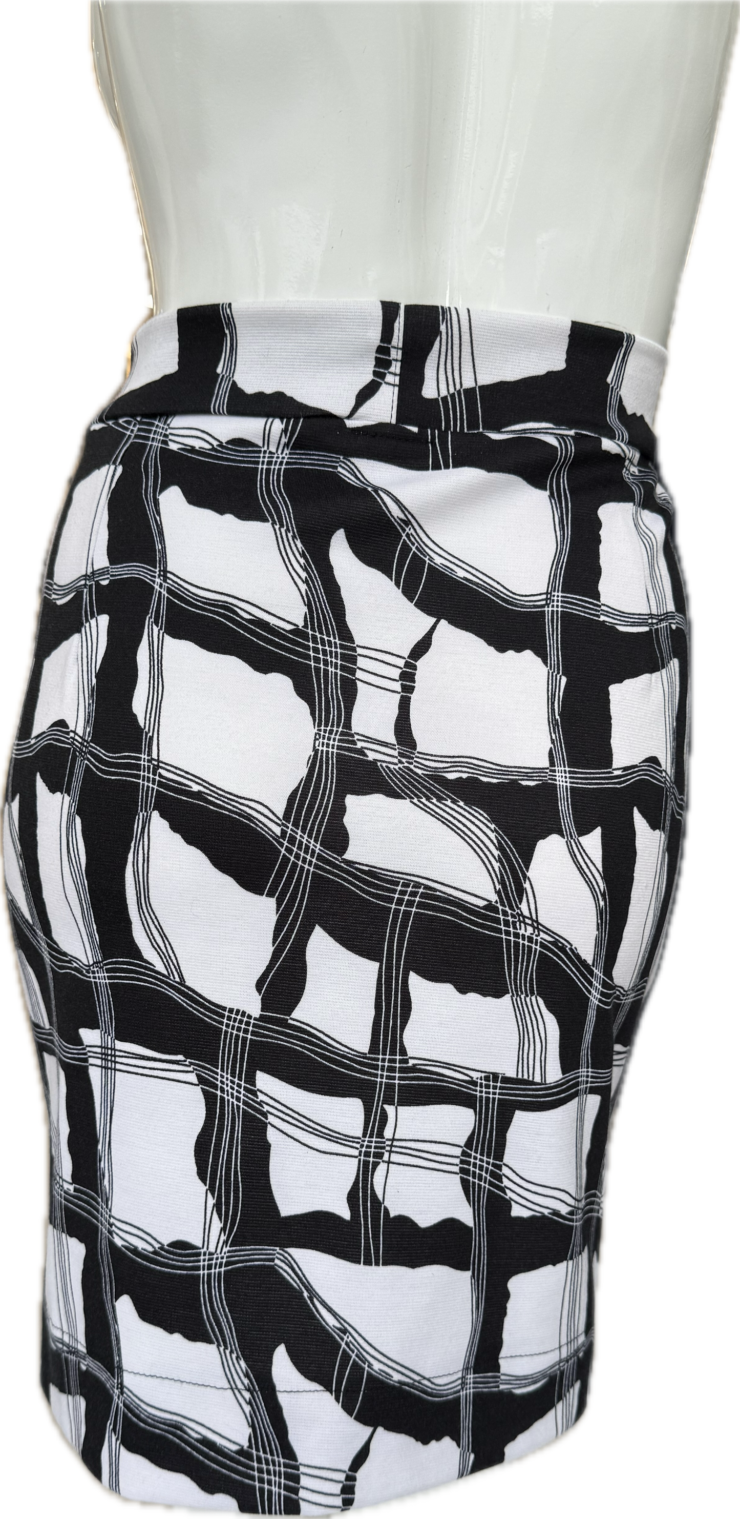 Back view of geometric print knit crepe skirt displaying striking black and white pattern with contemporary abstract design and comfortable fit