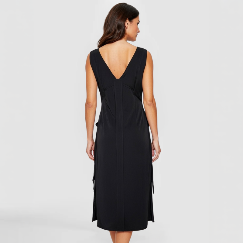 The SWABY Evie Dress shown from the rear on a fashion model. A stylish elegant dress that can be worn day or night.