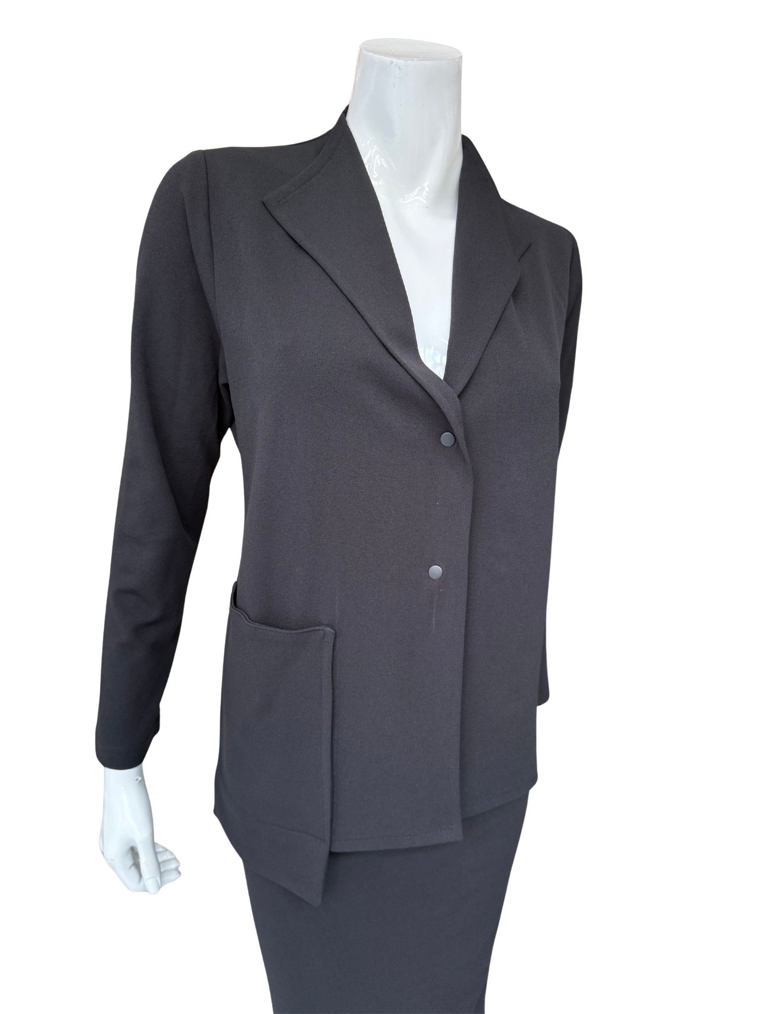 Front view of contemporary knit crepe jacket in charcoal featuring distinctive lapel design and minimalist button closure with structured silhouette