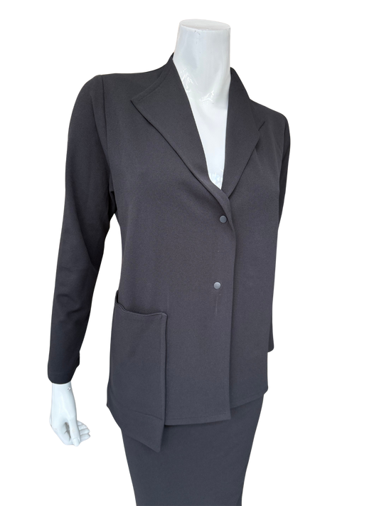 Front view of contemporary knit crepe jacket in charcoal featuring distinctive lapel design and minimalist button closure with structured silhouette