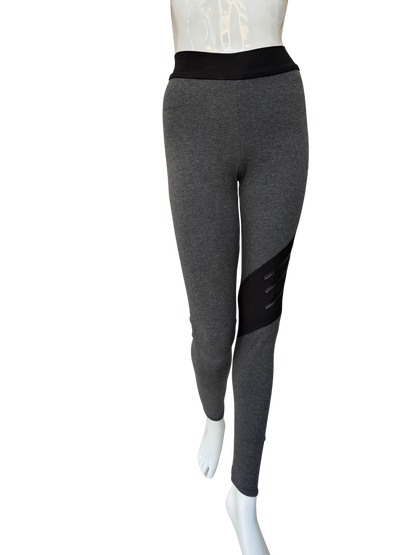 Front view of bold cotton lycra leggings in charcoal featuring diagonal washable leather trim panel and contrasting black waistband with full-length fit