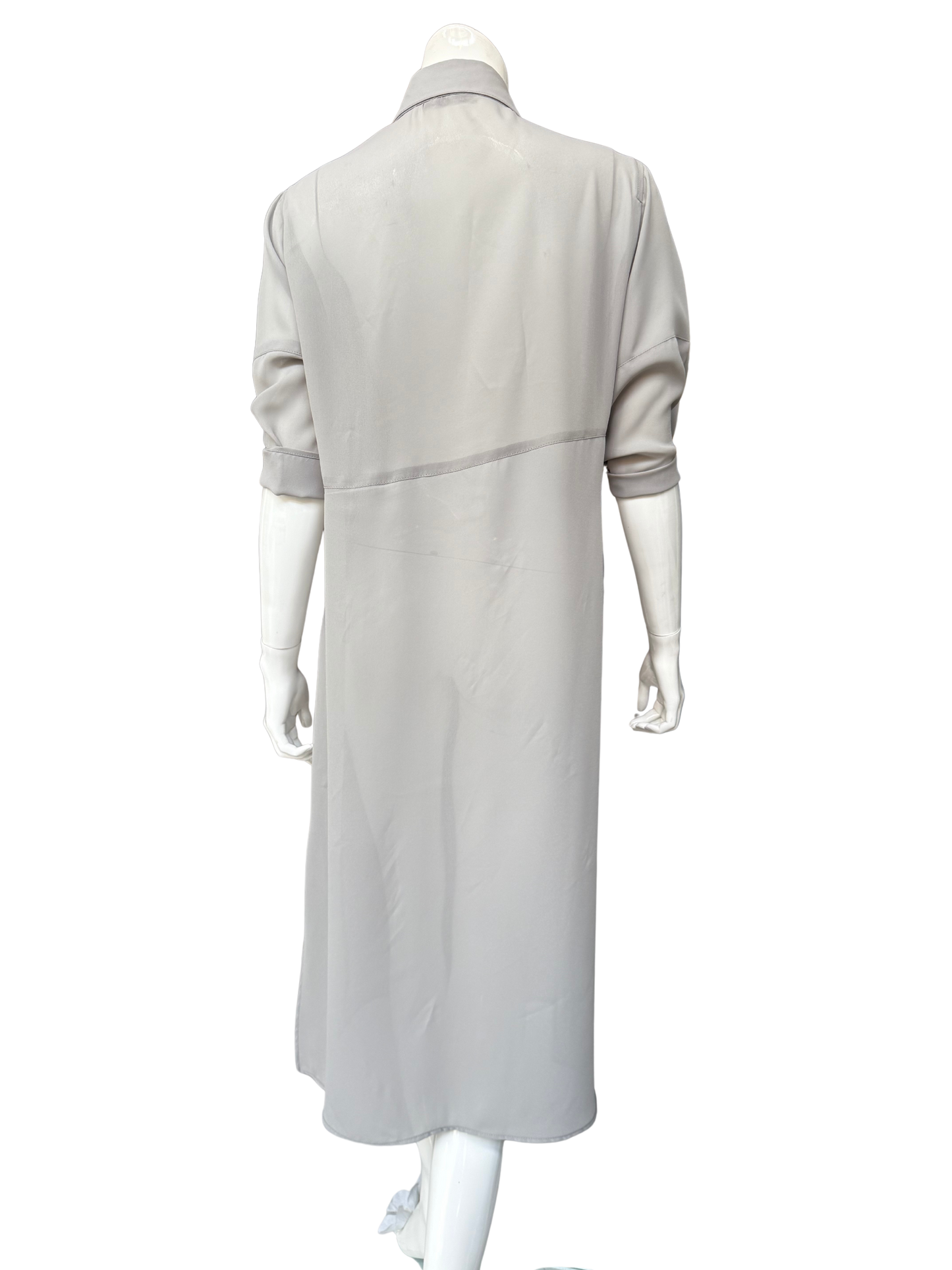 Back view of pale gray Knox Top georgette blouse on mannequin showing long shirt-dress silhouette with subtle side slits and flowing drape