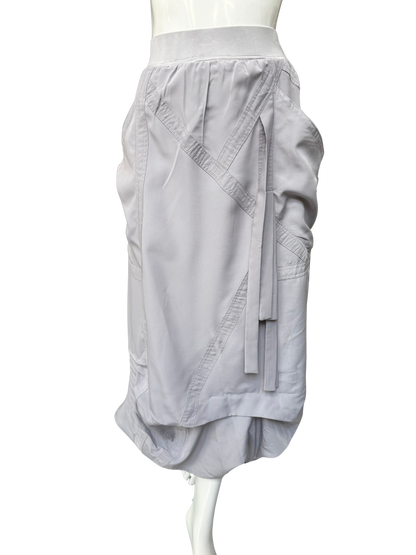 Close-up of white Blaine Skirt showing diagonal seam construction, adjustable drawstring details, and refined high-waistband design