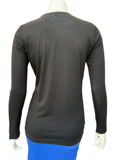 Back view of black cotton lycra top showing clean construction and comfortable stretch fit with quality fabric and sophisticated silhouette