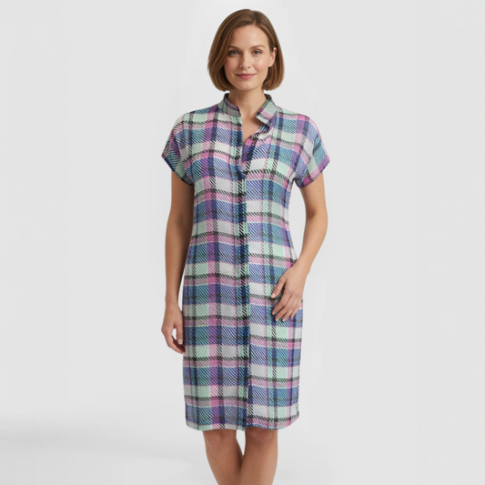 Short-sleeve knee-length chiffon shirt dress with classic collar and button-front placket in multicolor plaid of pink, purple, blue, and mint green with fine diagonal hatching throughout. Made by SWABY - A Chicago Fashion Designer.