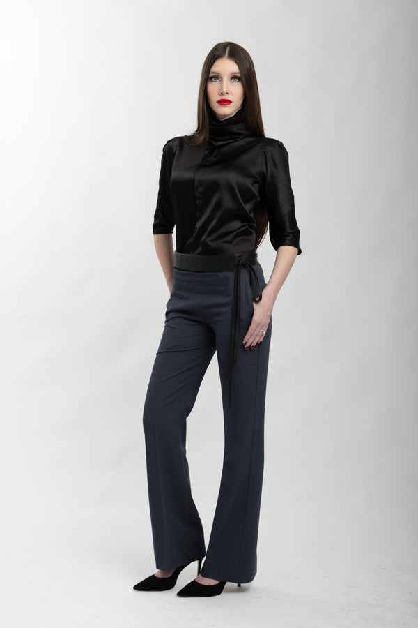 Black draped top with gray wide-leg pants