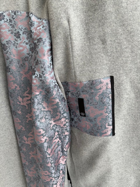 A view of the inside zip pocket of the Elyse Coat