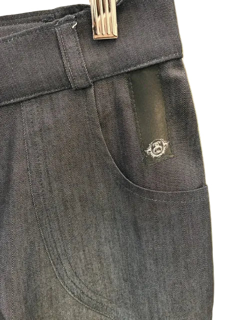 A close up view of the SWABY emblem on the left side pocket of a pair of SWABY Wide Leg Jeans.