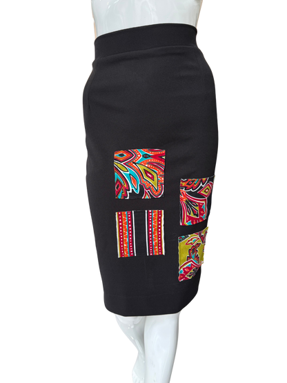 Side view of sleek black pencil skirt showing classic silhouette and knee-length cut with quality construction and comfortable high waistband
