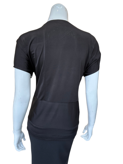 Back view of cowl neck top showing solid black construction with clean lines and comfortable knit fabric in sophisticated silhouette