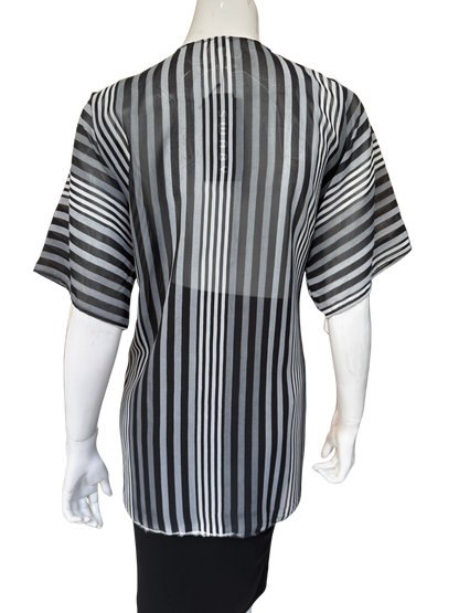 Back view of modern striped chiffon blouse showing dynamic vertical stripes in black and grey with flowing construction and short sleeves