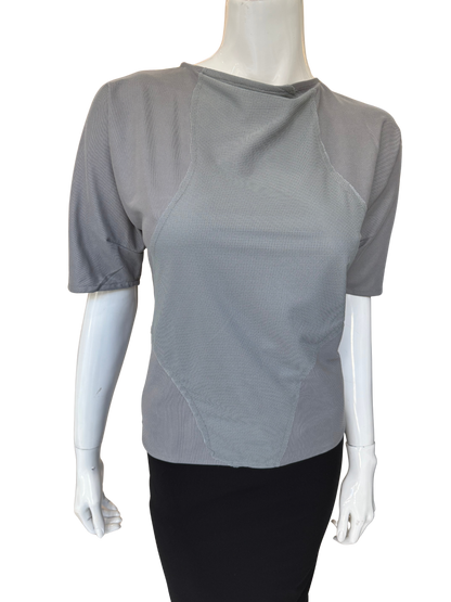Front view of quality grey patch detail top featuring asymmetrical neckline and distinctive textured panels with elbow-length sleeves and modern design elements