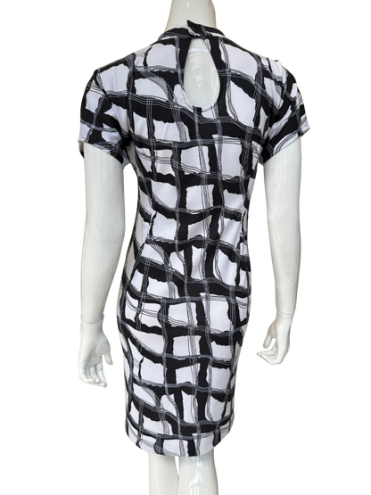 Back view of geometric print dress showing keyhole back detail and continuous pattern design in quality stretch crepe construction with modern appeal