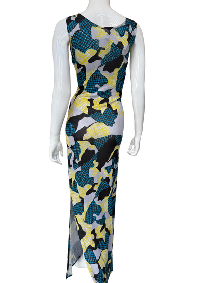 Back view of multi-color abstract print maxi dress showing continuous bold pattern and sleeveless design with elegant draping and sophisticated proportions