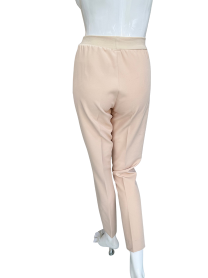 Back view of tan stretch crepe pants showing streamlined fit and quality construction with comfortable waistband and sophisticated tailoring