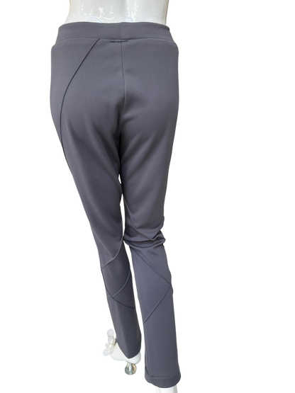 Detail view of charcoal stretch crepe pants featuring strategic seaming placement and comfortable waistband with quality construction and structured appearance
