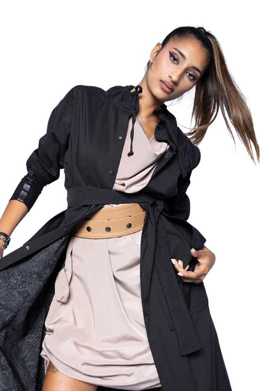 Model wearing black Mary Jane Jacket open over neutral outfit, showcasing dramatic collar detail and sophisticated layering with statement belt
