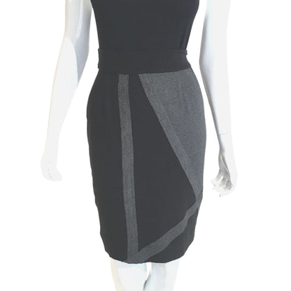 Black and heather charcoal Axle Skirt featuring asymmetrical contrast straps and sleek midi silhouette on mannequin