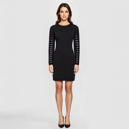 A model poses in a black Razor Dress with black leather patches on the sleeves