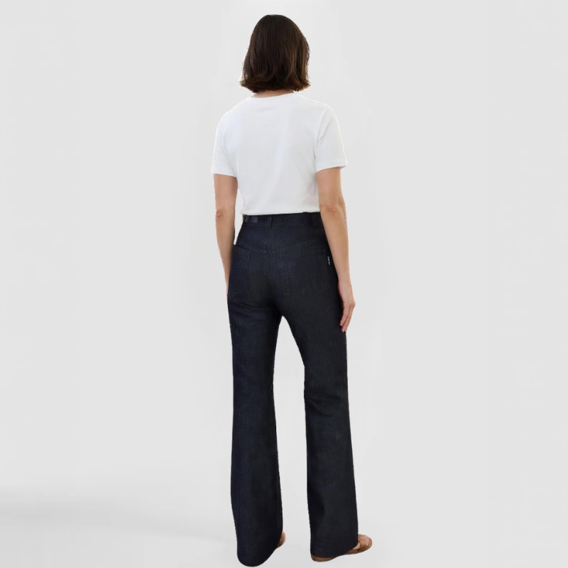 SWABY Wide Leg Jeans as shown in a rear view pose on a fashion model who is wearing a white t-shirt, showing how casual yet classy these jeans can be.  A SWABY Jeans black leather label is shown on the left of the waistband along with a SWABY Jeans tag on the right side of the right rear pocket. Available in navy, black and gray. Exclusively by SWABY - a Chicago Fashion Designer & New York Fashion Designer.
