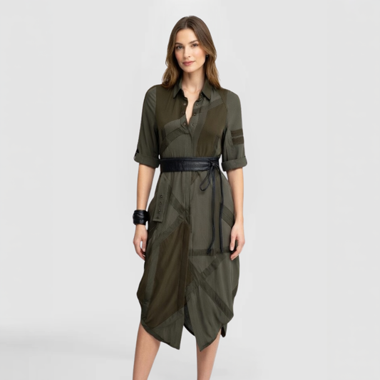 SWABY Shernett No. 7 Shirt Dress in army green. Midi-length silhouette with collared button placket, rolled elbow-length sleeves with tab closures, diagonal tonal paneling, asymmetric draped hemline, and black leather obi wrap belt. Created by SWABY - a New York Fashion Designer.