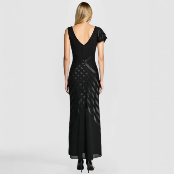 The back view of the Toleta Gown - a black evening gown with a draped design and shoulder accent