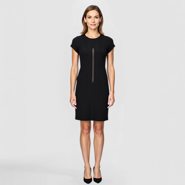 A model poses in the Trinity Dress featuring vertical detailing on the front 