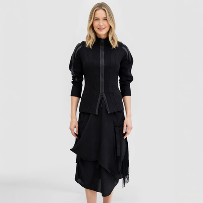 The Trinity Sweater, by SWAY - a New York Fashion Designer, shown here on a blonde fashion model featuring zip-front, hand-made surface lines and leather trim accents