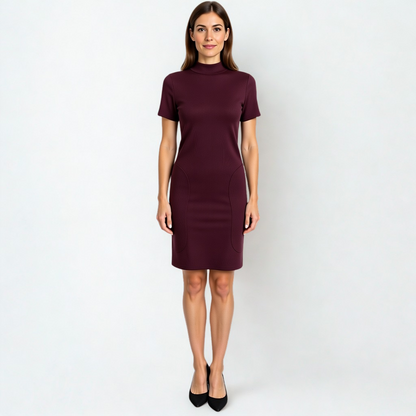 A SWABY model poses in a burgundy Modern Ribbed Knitted Dress